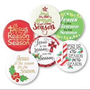 A collection of 36 assorted tin "Jesus is the Reason for the Season" badges, perfect as Christmas gifts and giveaways.