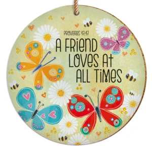 Close-up of a 10cm round Christian ceramic hanging plaque featuring an intricate design. This versatile hanging decoration, part of our collection of decorative hanging plaques, also functions as a coaster with its cork backing.