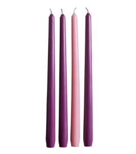 A set of four 10-inch Advent candles including three purple and one pink taper in a decorative gift box for Advent calendars.