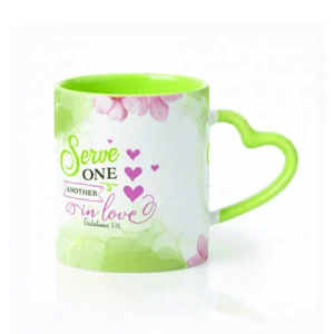 Ceramic coffee mug featuring a unique heart-shaped handle and the inspirational Galatians 5:13 scripture verse about serving others in love.