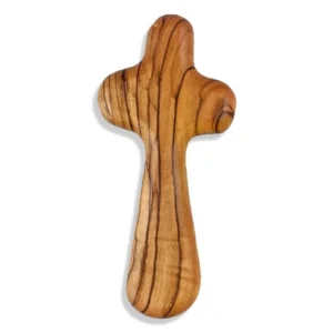 A smooth, hand-carved olivewood holding cross designed for prayer and meditation, presented with an accompanying inspirational card.