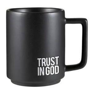 A stylish matte ceramic mug featuring a debossed Trust in God design with a large, ergonomic handle, perfect for coffee and tea enthusiasts looking for stackable kitchen mugs.