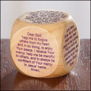 A wooden Lenten prayer cube for children featuring six silk-screened religious prayers, designed as an interactive educational tool for classroom lessons or daily devotions.