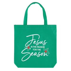 A white canvas tote bag from our collection of tote bags and pouches featuring the festive text Jesus is the Reason, perfect for carrying Christmas gifts or daily supplies.