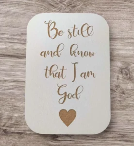 A decorative fridge magnet and keyring featuring the inspirational quote Be still and know that I am God, designed by the Rock Foundation charity.