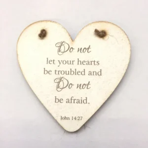 A decorative heart-shaped hanging plaque from the Rock Foundation, featuring the inscription Do Not Let Your Hearts and displayed as a thoughtful wall decoration.