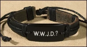 An adjustable leather and acrylic bracelet featuring the engraved text WWJD, presented as a thoughtful accessory for Father's Day gifts or religious wristbands.