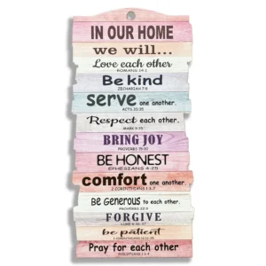 A large stacked wooden hanging plaque featuring the inspirational phrase In our home we will, serving as a beautiful piece of faith-based wall decor and a meaningful heavenly blessed gift for a Christian home.