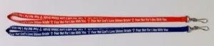 A set of two lanyards in blue and orange featuring the motivational phrase Fear Not For I Am With You, suitable for teachers and volunteers at children's events as a practical Halloween alternative.