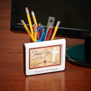 A decorative desk-top photo frame featuring the quote Serving with a Heart Like Jesus, integrated with a functional pencil cup holder for organized office or home decor.